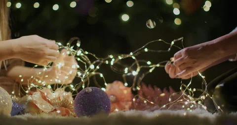 Preparing for Christmas and New Year, hands unraveling garlands Stock Footage 249621383