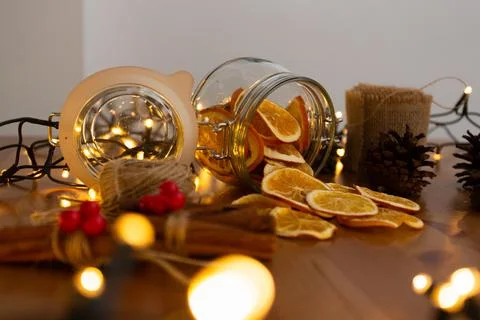 Preparing christmas decorations with blurry christmas lights in foreground, d Stock Photos