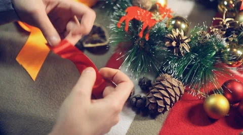 Preparing for Christmas , a master class on making a bow from a tape Stock Footage 57657294