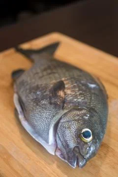 Preparing a chub fish for dinner in the kitchen Stock Photos