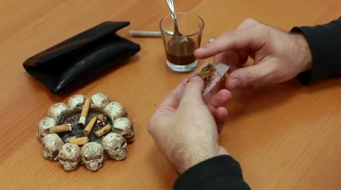 Preparing a cigarette Stock Footage 8854191