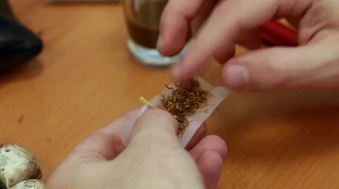 Preparing a cigarette Stock Footage 8871668