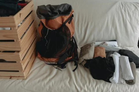 Preparing clothes into the backpack for the travel trip. Stock-Fotos