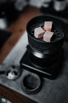 Preparing coal for a hookah Stock Photos