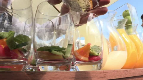 Preparing cocktail glasses outside Stock Footage 47525744