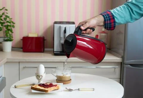 Preparing coffee and a served breakfast Stock Photos