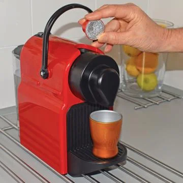 .Preparing a coffee, with electric coffee maker Stock Photos