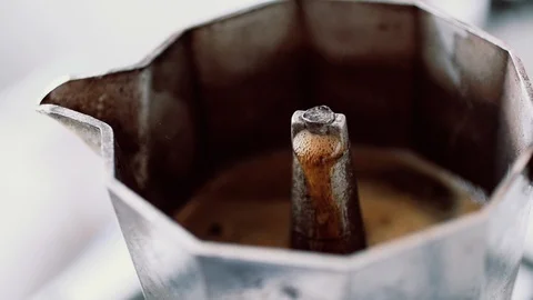 Preparing coffee with the geyser coffee maker on the kitchen Stock Footage 85845814