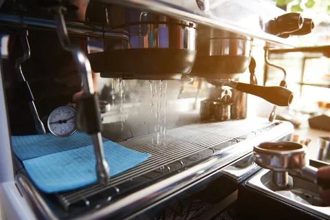 Preparing the coffee machine for brewing coffee. Starting a professional stea Stock Photos