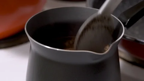 Preparing coffee in a Turkish coffee maker Stock-Footage 88260320