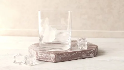 Preparing cold coffee, hand pouring ice and pouring coffee into a glass Stock Footage 151077041