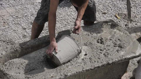 Preparing Concrete Manually. Collect Concrete Into Buckets Stock Footage 281336102