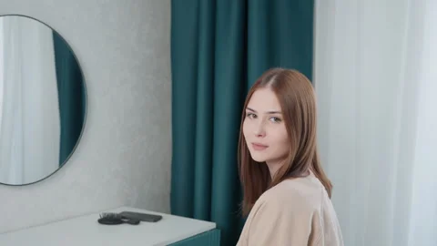 Preparing confidently at stylish bedroom vanity. Selfassured person practicing Stock Footage 346224595