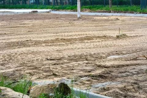 Preparing the construction site for asphalt paving or foundation laying Stock Photos