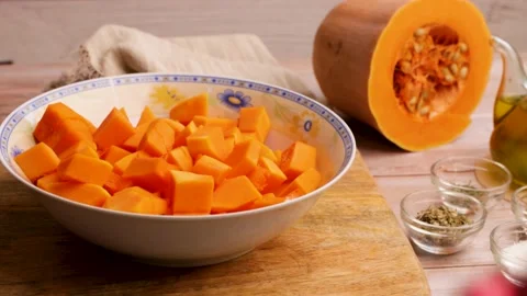 Preparing to cook baked pumpkin. 2 Stock Footage 219346633