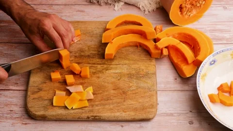 Preparing to cook baked pumpkin. 22 Stock Footage 219346704