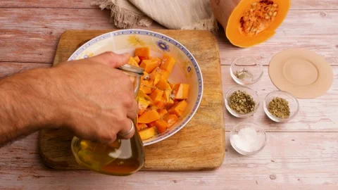 Preparing to cook baked pumpkin. 26 Stock Footage 219346735
