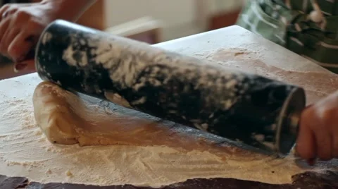 Preparing cookie dough with a rolling pin Stock Footage 41484807
