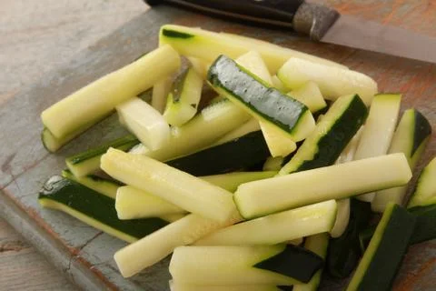 Preparing courgette batons Stock Photos
