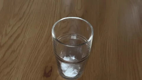 Preparing a Creatine Supplement Drink as Part of a Workout Nutrition Routine Stock Footage 309881054