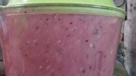 Preparing Crystal Guava Juice Inside a Blender Cup Stock Footage 229199736