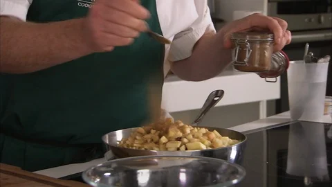 Preparing cubed apples for a dish Stock Footage 88040847