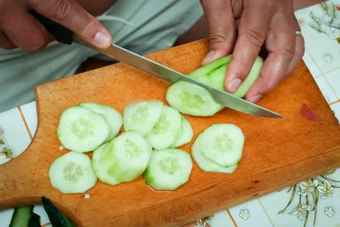 Preparing cucumber on board Stock Photos
