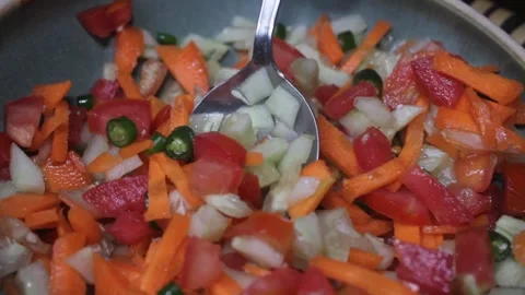Preparing  cucumber, carrot and tomatoes mixed salad Stock Footage 331278081