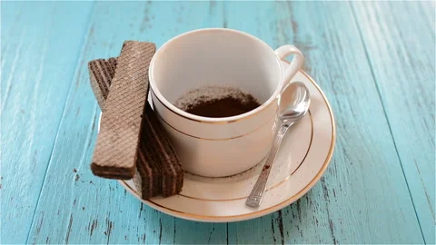 Preparing cup of coffee with wafers Stock Footage 100967066