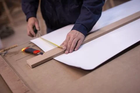 Preparing to cut a white long sheet of paper Stock Photos