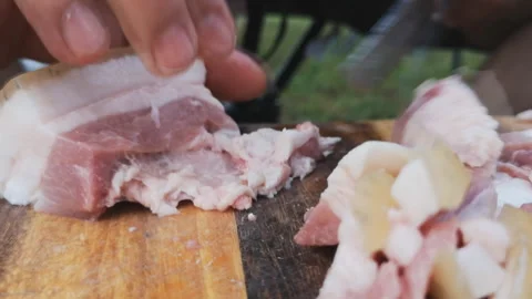Preparing for cutting raw pork for cooking. Stock Footage 140487538