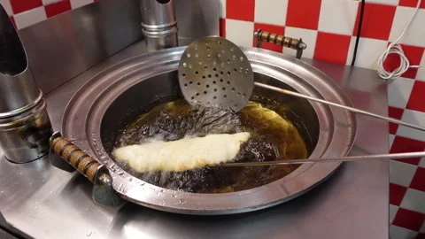 Preparing a deep-fried pizza ('fritta') in Napoli, food and culture in Italy Stock Footage 288003168