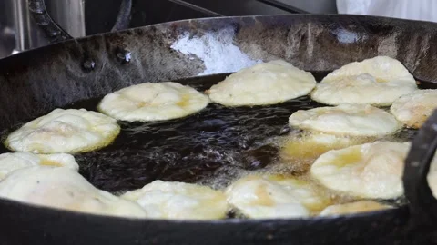 Preparing deep fried street food in a frying pan. Stock Footage 245201644