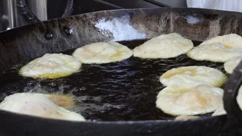 Preparing deep fried street food in a frying pan. Stock Footage 245201731
