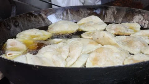 Preparing deep fried street food in a frying pan. Stock Footage 245201750