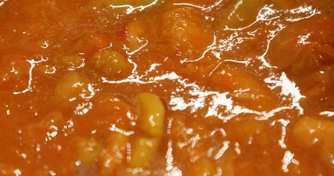 Preparing a delicious apricot jam - close up shot Stock Footage 112136553