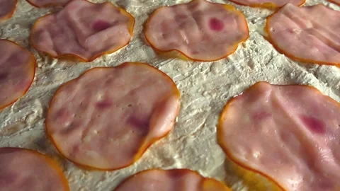Preparing delicious ham slices on flatbread Stock Footage 344104124