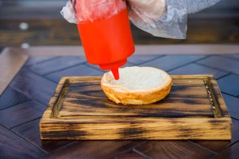 Preparing delicious hamburger Stock Photos