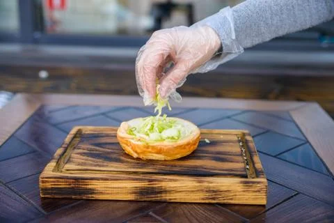 Preparing delicious hamburger Stock Photos