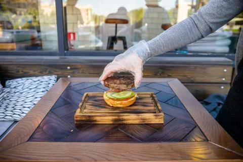 Preparing delicious hamburger Stock Photos