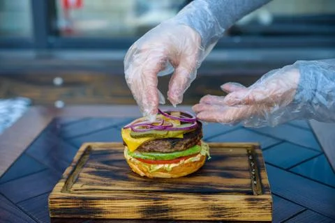 Preparing delicious hamburger Stock Photos