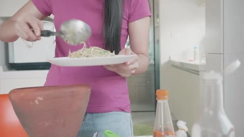 Preparing a Delicious Meal in a Modern Kitchen Stock Footage 313918453