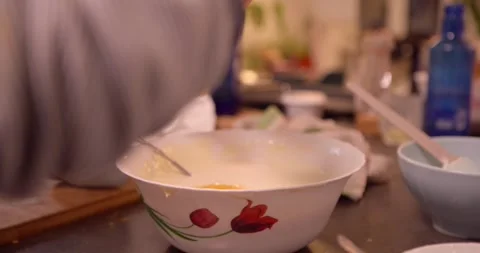 Preparing a delicious mixture in a bowl: Stock Footage 331400386