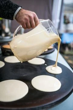 Preparing delicious pancakes Stock Photos