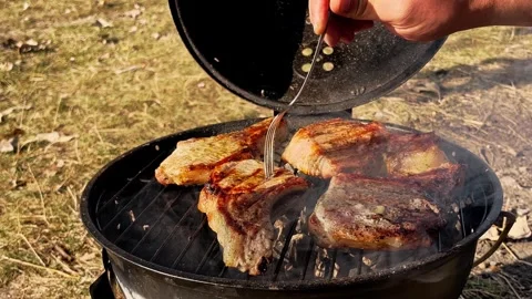 Preparing of delicious pork neck steaks on a grill pan Stock Footage 253151455
