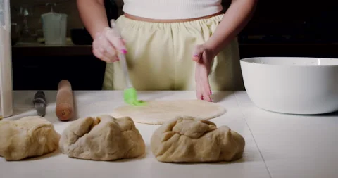 Preparing dessert, dough for a pizza or a festive meal in the kitchen. Stock Footage 150268151