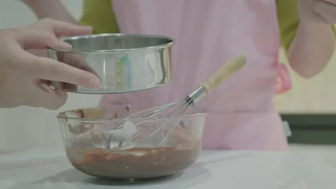 Preparing a Dessert Mixture with Hands in the Kitchen Vidéo 342281621