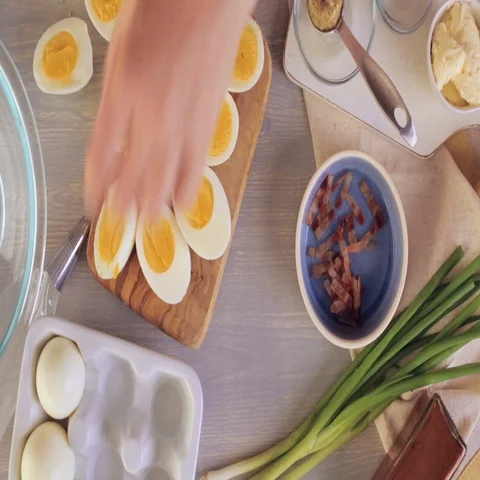 Preparing deviled eggs with organic eggs for appetizer. Step by step recipe. Video stock 69727496