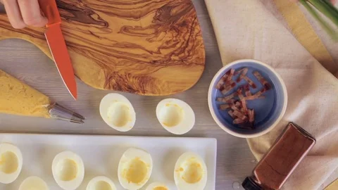 Preparing deviled eggs with organic eggs for appetizer. Step by step recipe. Video stock 69728595