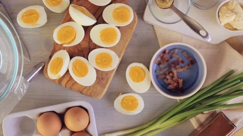 Preparing deviled eggs with organic eggs for appetizer. Step by step recipe. Video stock 69728600